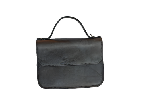Blue vegan leather handbag on a white background