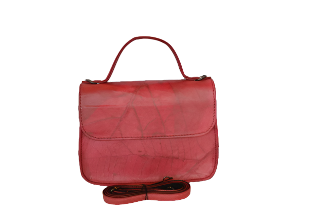 Red handbag with a strap on a white background