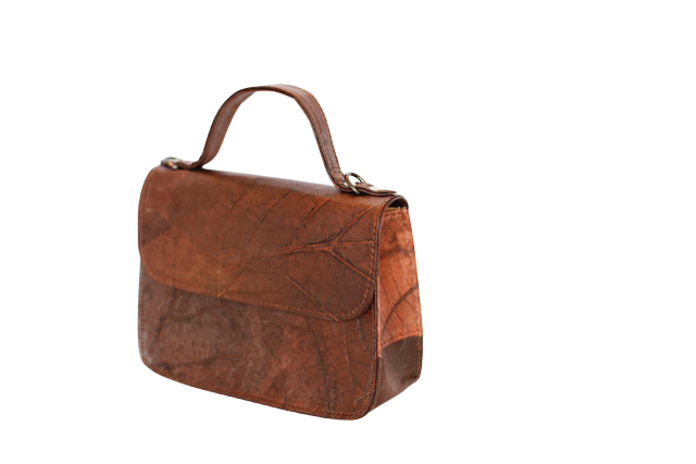 Brown vegan handbag on a white background