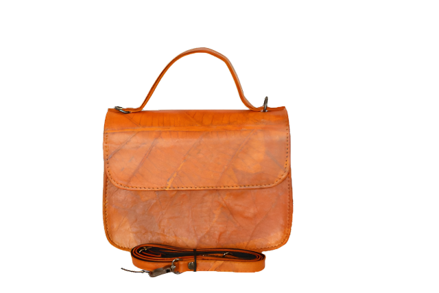 Orange Vegan handbag with a strap on a white background